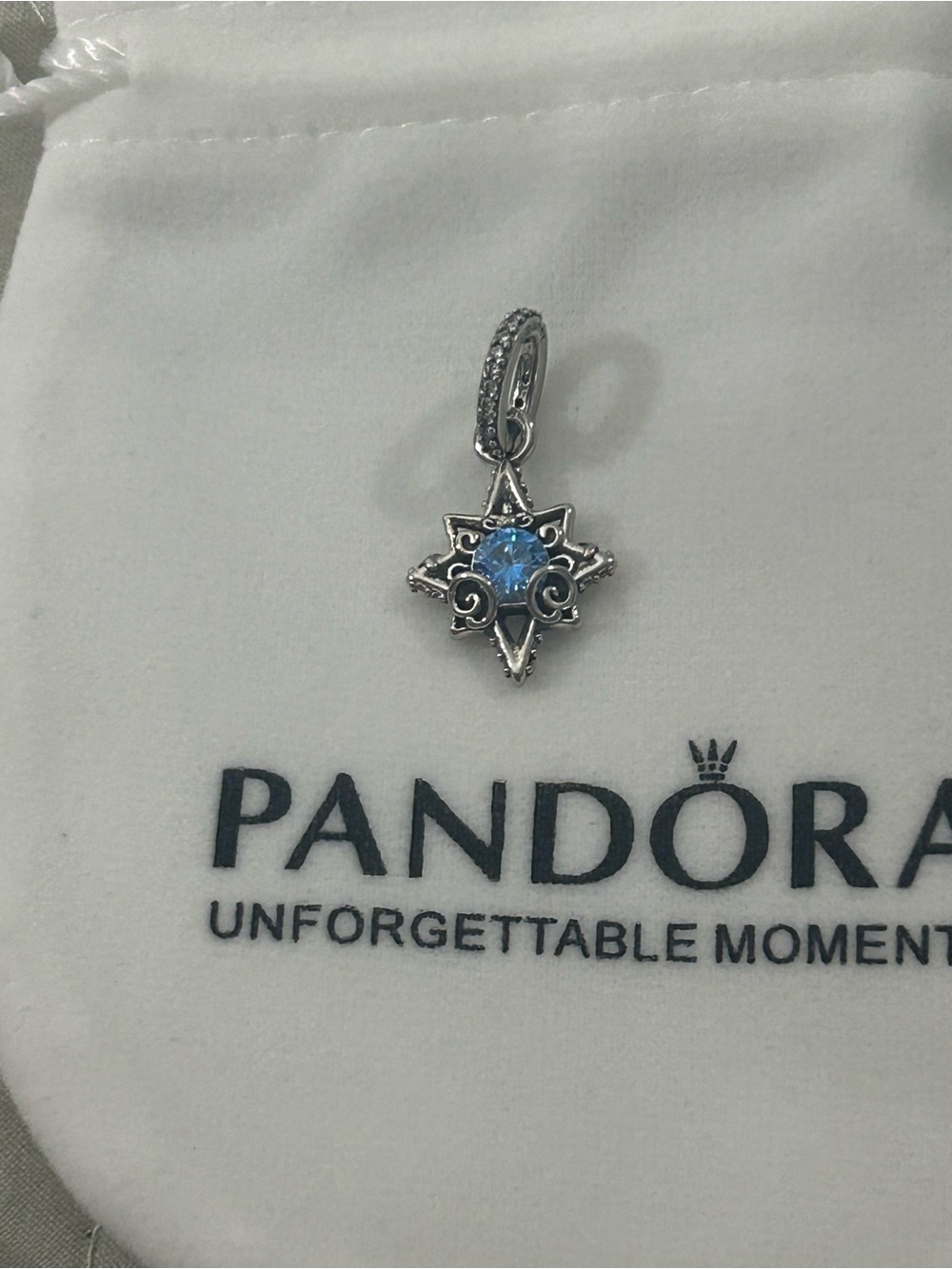 Pandora Silver Starburst Charm with Light Blue Gem
